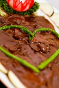 drunken lengua in mushroom brown sauce